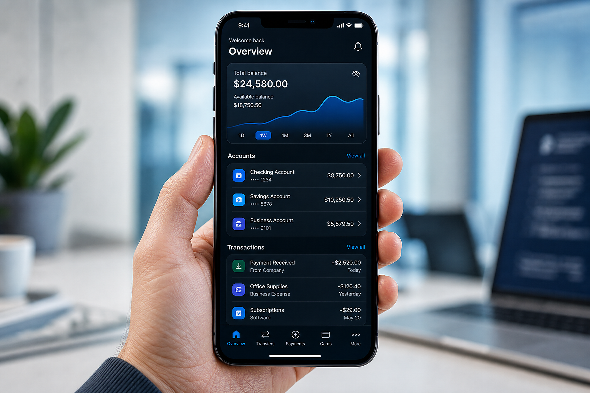 Hand holding a smartphone showing a modern banking app
